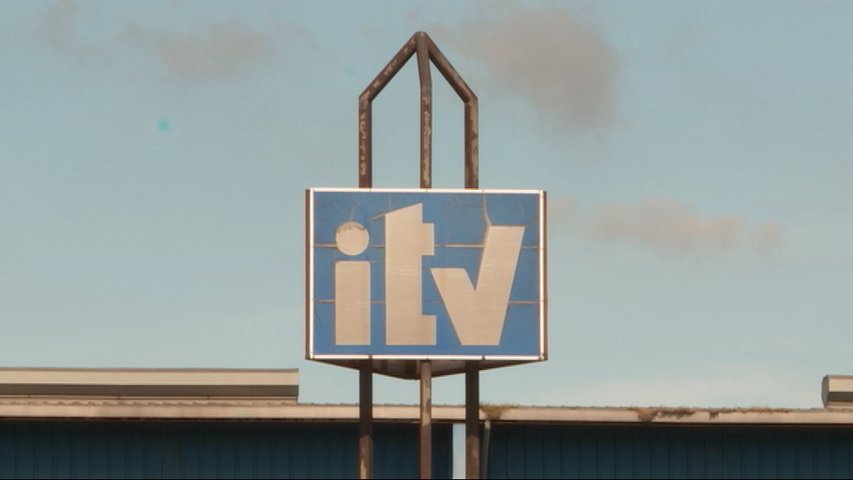 Cartel de una estación de ITV